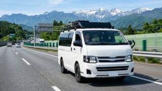 Toyota Hiace Roof Carrier with Wind Deflector Fairing on Highway